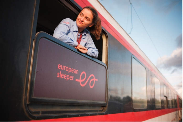 Girl looking out from window of ESL train