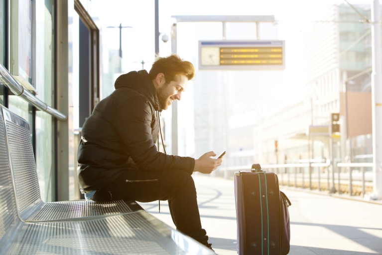 happy_man_waiting_for_train_